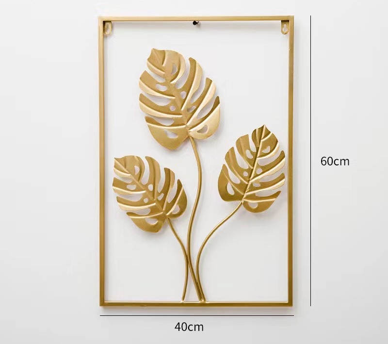 Decoración de pared con hojas doradas en forma de caparazón de tortuga.
