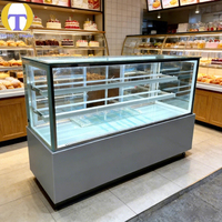 Vitrine à gâteaux moderne de luxe en verre trempé avec éclairage LED, robuste et personnalisable pour les magasins de détail et les centres commerciaux