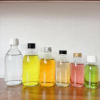 Étiquettes personnalisées emballage de qualité alimentaire ambre clair vide distributeur de médicaments maigres sirop toux bouteilles en verre oral avec bouchon à l'épreuve des enfants