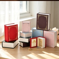 Nouvelle boîte à bijoux vintage en forme de mini livre, en cuir PU éponge, imprimée quatre couleurs, estampée à chaud, pour rangement de bagues, pendentifs et montres motif ciel étoilé