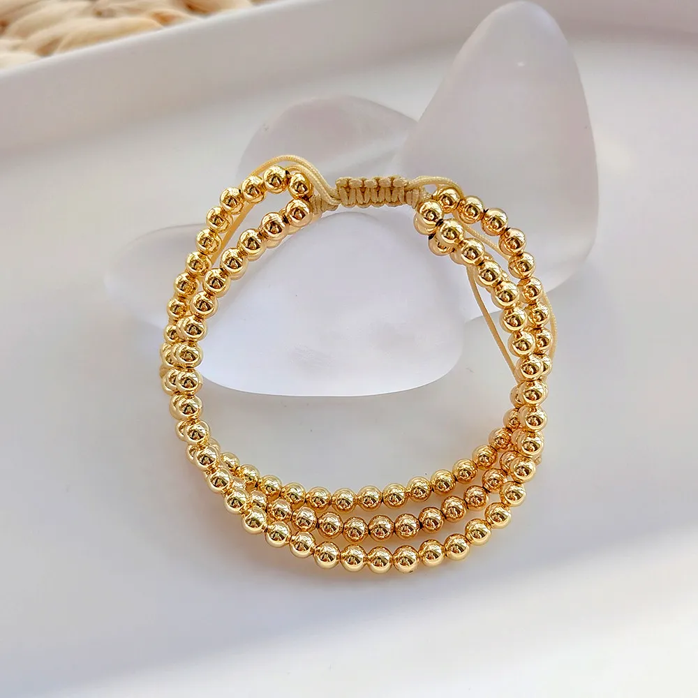 Cadena elástica sin deslustre Bola chapada en oro de 18 quilates Pulsera ajustable con cuentas minimalistas multicapa para mujer