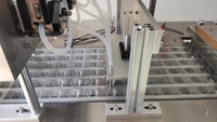 Machine automatique de remplissage et de scellage de coupelles et de pains de communion préremplis