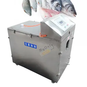 La macchina per la lavorazione del pesce al forno per l'uccisione automatica dei pesci rimuove la scala e sventola nel coltello