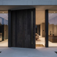 Solutions de portes en bois massif architecturales pour les entrées extérieures modernes et les développements résidentiels