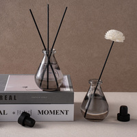 Flacon diffuseur rond en verre gris de luxe de 100 ml avec couvercle hermétique pour l'affichage et la recharge d'huiles parfumées pour la maison