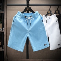 Shorts de sport pour hommes personnalisés en gros, à taille élastique, imprimés, séchage rapide, pour la course, la gym et la plage, en polyester/coton, à bas prix