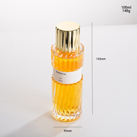 Flacon de parfum de luxe 100 ml en verre transparent, nouveau design, cylindrique torsadé, vide, avec pulvérisateur et capuchon