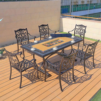 Ensemble table et chaises de jardin européennes modernes en carbone pour l'extérieur, idéal pour les repas et les barbecues en cour.