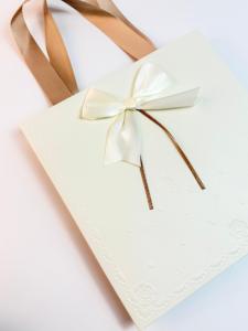 Custom Creative Ivory Board Paper Women Gift Bag <b>With</b> Flat Handles Embossed Design Ribbon <b>Bow</b> Rectangle Gift Bag For Clothes - Product Image 4