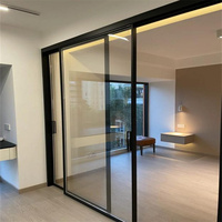 Porte coulissante moderne en alliage d'aluminium et verre trempé pour villa et hôtel, avec surface finie