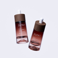Flacon d'huile essentielle 30 ml en verre cosmétique au design unique de fond volcanique, finition mate, avec compte-gouttes à anneau en bois