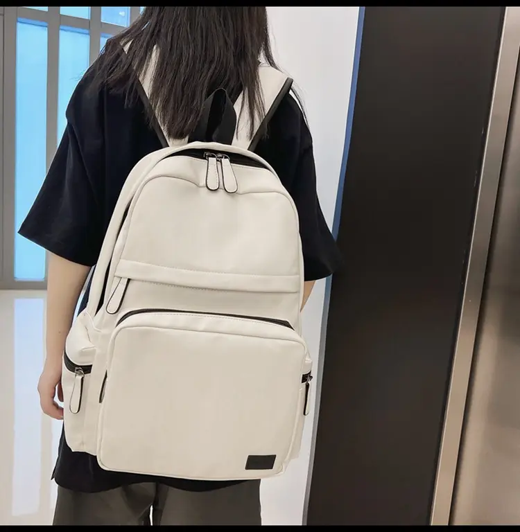 2022 New water repellency PU leather bag computer bags large capacity backpack men and women simple leisure backpack