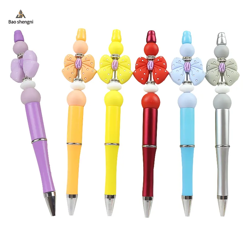 2023 nouvelle nouveauté décorative avec stylo à bille en silicone ajouter un stylo à bille haut créatif à pois stylos à perles arc pour les enfants