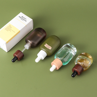Flacon compte-gouttes en verre de luxe à fond épais de 15 ml et 30 ml avec logo personnalisé et estampage doré pour huiles essentielles, sérums et parfums vides