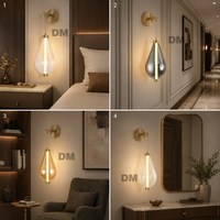 Applique murale LED minimaliste italienne en verre ambré fumé transparent en forme de goutte d'eau, base dorée, lumière chaude, pour villa et fond TV