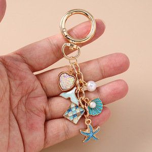 Llavero de lujo con diseño de perlas y temática oceánica, con escamas de sirena, corazón y estrella de mar, para mujer, colgante para bolso, venta al por mayor - Product Image 4