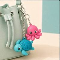 Llavero de PVC de goma suave OEM/ODM, pulpo rosa divertido en 3D, personalizado con logotipo para mochila de niñas, decoración de ropa, colgante