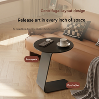 Table basse ronde moderne avec plateau en métal et structure en acier, design minimaliste mobile pour salon et salle à manger