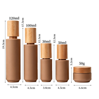 Ensemble de pots à crème pour le visage en verre kaki OEM ODM avec bouchon en bois naturel pour l'emballage cosmétique