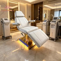 Table de massage esthétique médicale moderne haut de gamme à 4 moteurs, base en acier inoxydable doré, éclairage LED, mobilier de salon de beauté