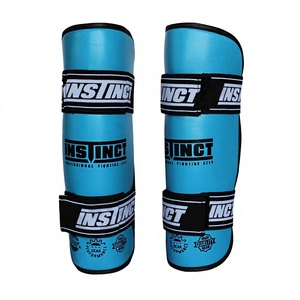 Protège-tibias professionnels en cuir PU durable, personnalisables avec logo, pour boxe thaï et kickboxing – Légers et très demandés - Product Image 1