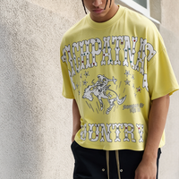 T-shirt Homme Jaune Clair Motif Cowboy Western Rivets Étoiles Imprimé Coupe Courte Oversize Épaules Tombantes Streetwear Nouvelle Collection 2025