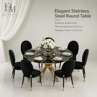 Table de banquet de mariage ronde personnalisée en acier inoxydable doré avec base en ruban croisé et plateau en verre trempé miroir