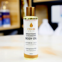 Huile pour le corps éclaircissante et illuminante FDOB SKIN 200 ml, flacon ambré, formule nourrissante, complexe de vitamines C et E, sans hydroquinone, citron