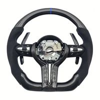 Volant en fibre de carbone pour BMW, disponible pour une personnalisation haut de gamme. Parfait pour votre propre véhicule ou comme cadeau haut de gamme.