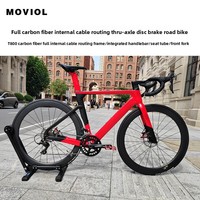 Vélo de route en fibre de carbone avec guidon intégré, passage des câbles entièrement dissimulé, freins à disque doubles, jeu de roues en fibre de carbone
