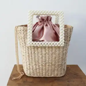 2022 neues Design Großhandel Frau Rattan Einkaufstasche hand gefertigte, elegante Perle Griff Stroh Strand tasche in Tasche Kordel zug