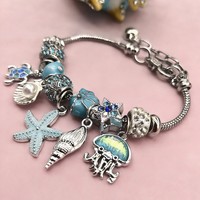 Bracelet tendance en alliage avec perles, éléments de plage, étoiles de mer et cœurs – Collection été
