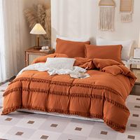 Ensemble de couvre-lit bohème uni lavable en machine avec pompons, en fibres synthétiques, teinture réactive, pour l'exportation transfrontalière, usage domestique