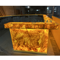 Comptoir de bar de luxe en marbre onyx avec éclairage LED de grande taille pour restaurant musical, hôtel, aéroport, salon VIP