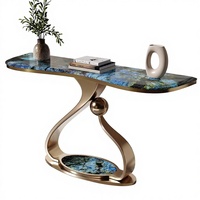 Console d'entrée en métal de luxe léger avec plateau en marbre et structure en acier inoxydable, design silencieux pour usage en restaurant