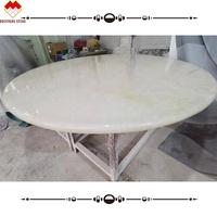 Table en pierre d'onyx blanche comme neige au design moderne table ronde de luxe personnalisée en onyx naturel bon prix