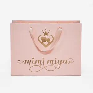 Индивидуальные печатные брендовые бумажные пакеты розовые черные роскошные подарочные упаковочные пакеты для одежды сумка для покупок с вашим собственным логотипом