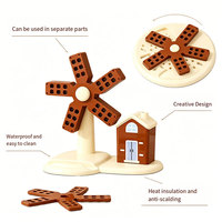 En gros, dessous de plat en silicone motif moulin à vent, multifonctionnel, pliable, résistant à la chaleur et antidérapant, pour la protection de la table de cuisine