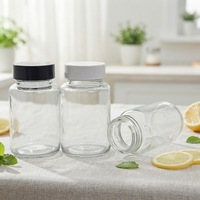 Vente en gros de bouteilles en verre rondes transparentes de 65ml 100ml bouteilles de pilules pharmaceutiques capsule de médicaments bouteilles en forme de pilules avec bouchon