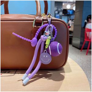 พวงกุญแจรถลายหน้ายิ้มสีสันสดใส ของขวัญสำหรับผู้หญิง จี้ห้อยกระเป๋าเป้ สร้อยเชือกไนลอน - Product Image 4