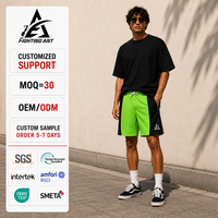 Shorts de bain et de surf pour hommes en polyester 100% OEM ODM, à panneaux contrastants incurvés, longueur 10 pouces, séchage rapide, style streetwear, pour la plage et le quotidien