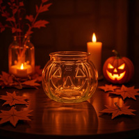 Pot à bougie en verre en forme de citrouille avec poignée en métal pour la décoration d'ambiance du festival d'Halloween