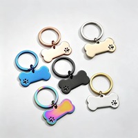 Porte-clés tendance en acier inoxydable, forme d'os avec empreinte de patte mignonne, gravure personnalisée, anti-perte, finition brillante, avec anneau fendu