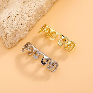 Grillz para dientes con diseño de estrellas en oro y plata, para fiestas, unisex, estilo hip hop. - Product Image 1