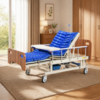 Lit médical multifonctionnel à manivelle manuelle, avec plateau incurvé pour maintien de la posture du patient et cadre en bois, pour usage en milieu médical