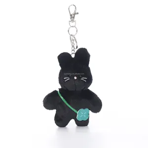Wholesale Cute Fluffy Stuffed Cat Toy Little black cat doll carrying a bag A gift for a child from a black cat mascot doll