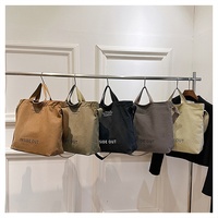 Sac à main élégant et moderne en toile pour femme, sac à bandoulière pour trajets quotidiens, grande capacité, sac d'école décontracté vintage avec bouton à lettres
