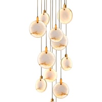 Lustre d'escalier en colimaçon moderne et simple tout en cuivre Nouveau design en marbre espagnol Chinoiserie pour maison duplex Moyen pour creux