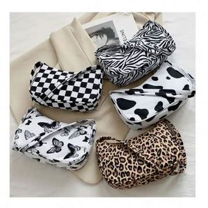 Wholesale Butterfly <b>Candy</b> Pattern Button Closure Single Strap PU Handbags Fashion Women Shoulder Bags 6 Inch Polyester Lining - Product Image 1
