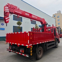 Camion-grue pour zones minières, pour la manutention de minerai, les opérations de levage et le transport sur route dans les mines